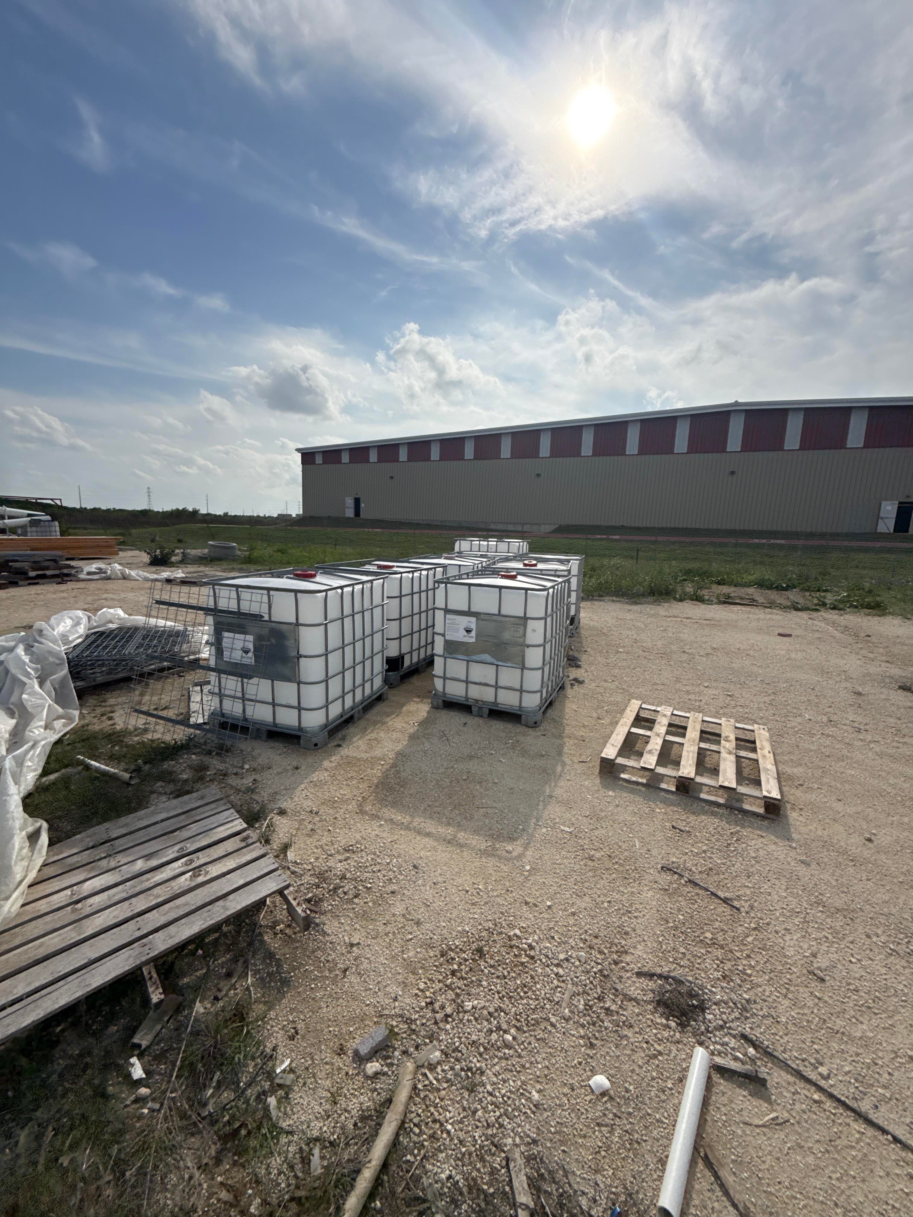 Bulk Lot of Used IBC Totes in Steel Cages with Plastic Tanks