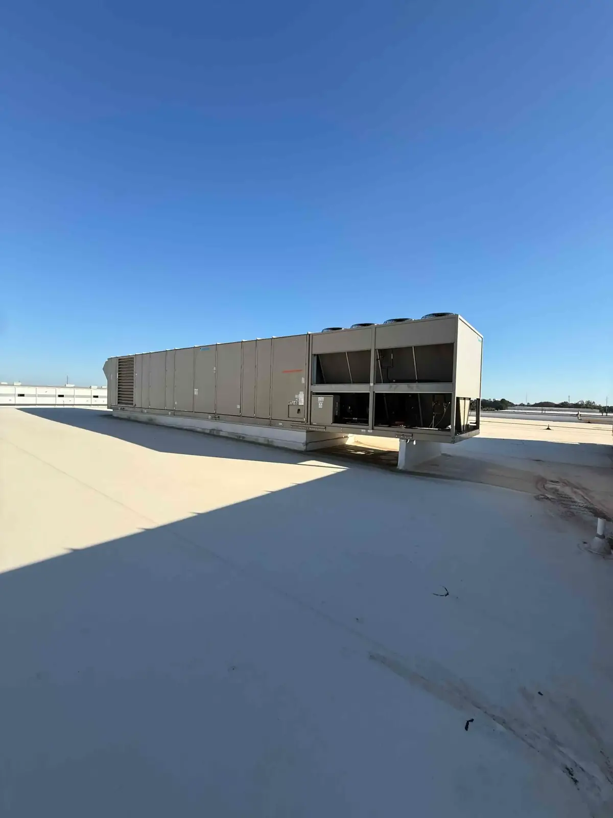 SB6004: RTU-6 – Daikin RPS 130D Rooftop Packaged HVAC Unit, 130 Ton Nominal, ~38,000 CFM Supply Airflow, Air-Cooled DX Package
