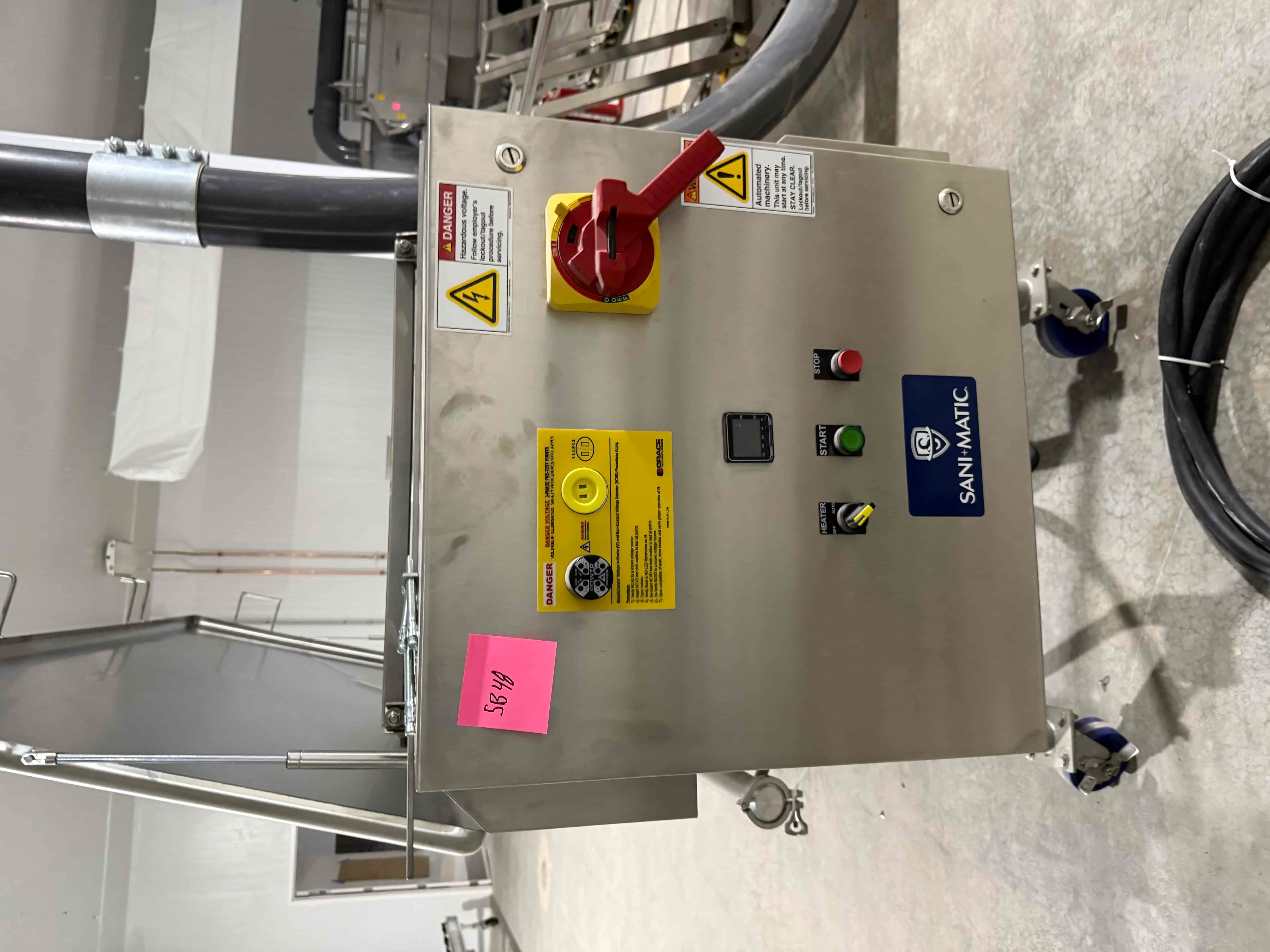 SB48: Sani-Matic stainless steel control cabinet with heater, start/stop, and emergency shutoff controls.