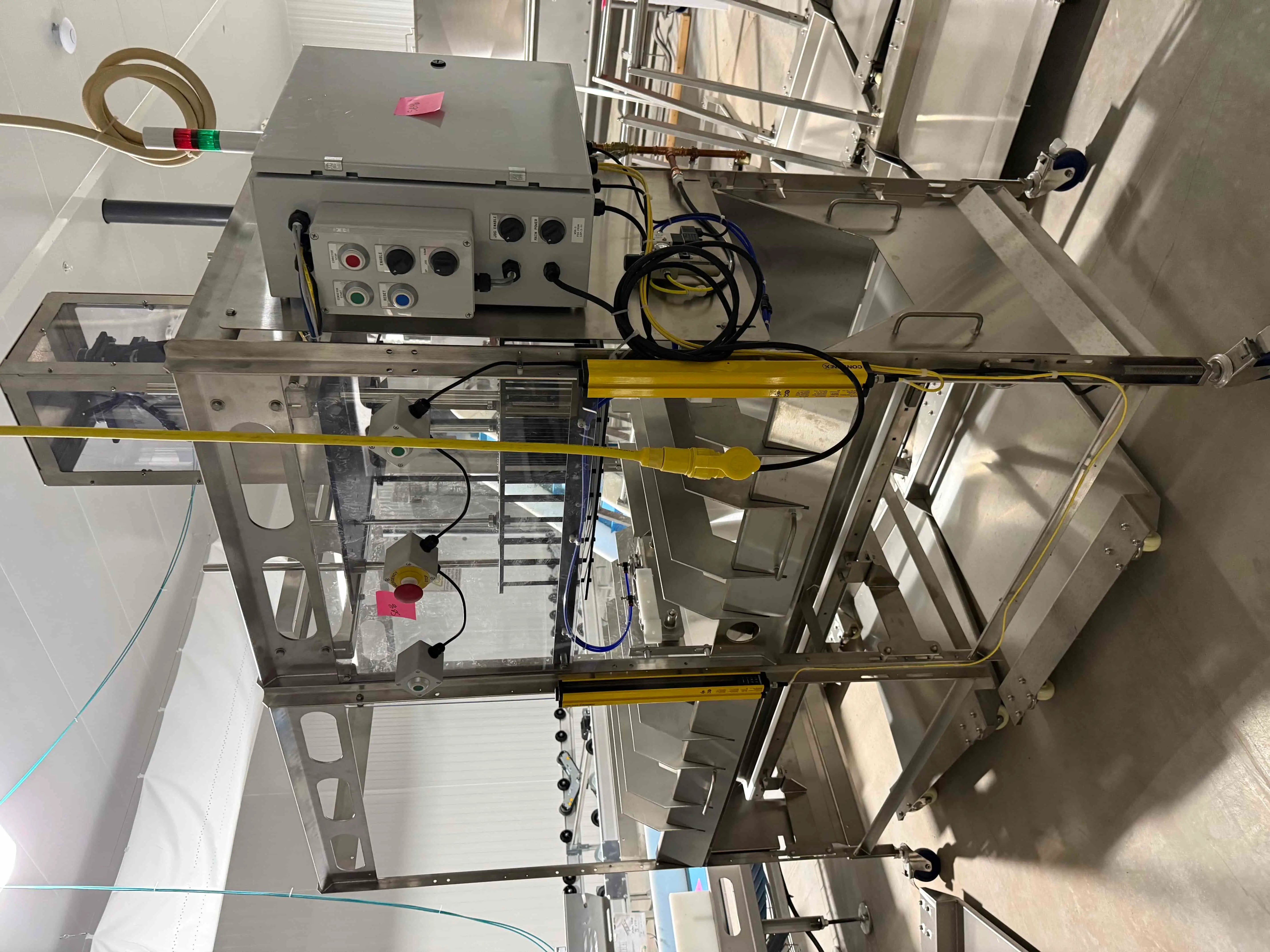 SB46: Koppert Machines Plug Puncher / Substrate Ejector with Integrated Conveyor, SCE Control Panel, Contrinex IO-Link Sensor, and Safety Light Curtain – Retail price $32,475. Located in Tray Washing Room