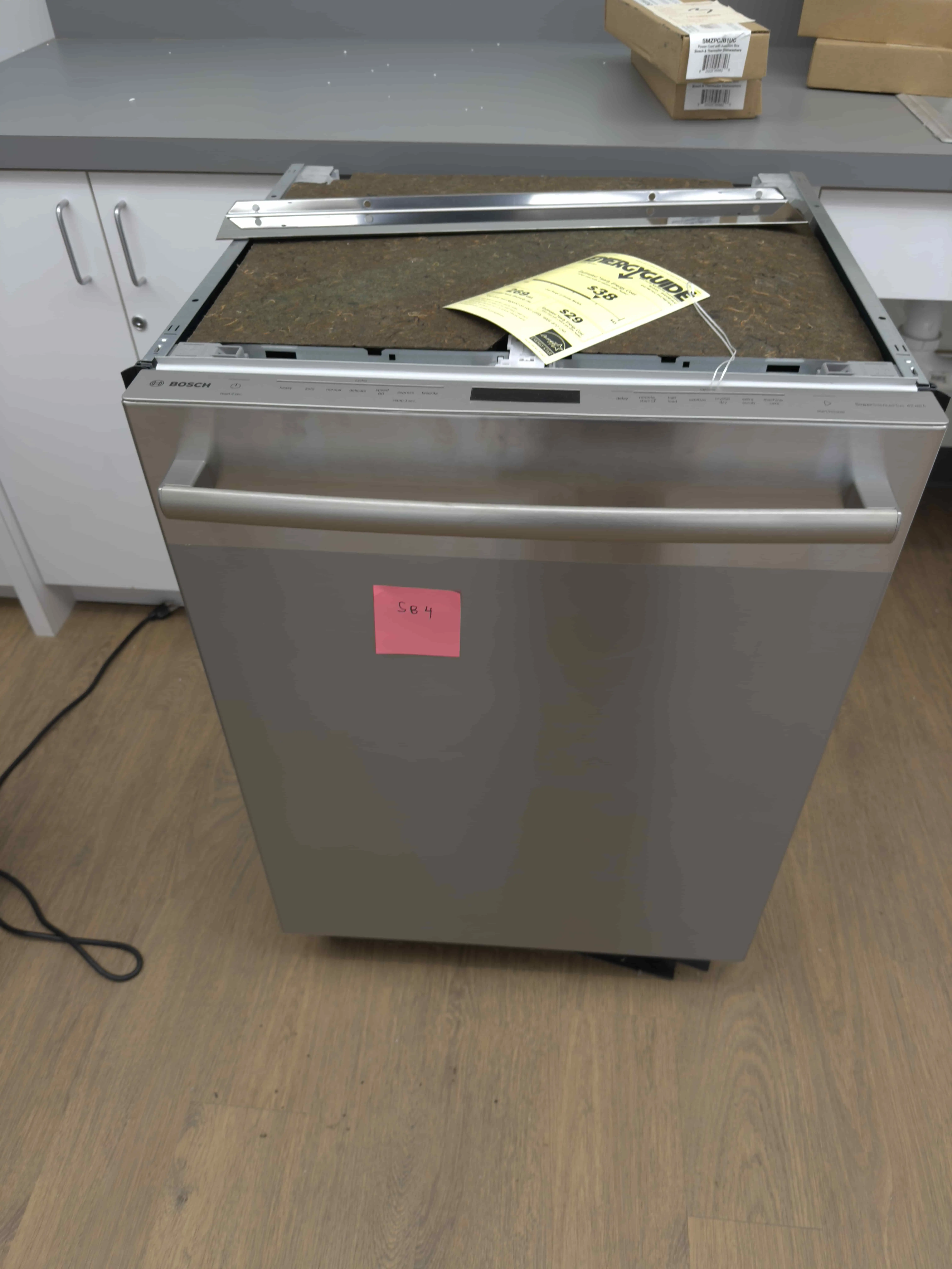 SB04: Bosch stainless dishwasher with concealed controls; includes top mounting rail as pictured.