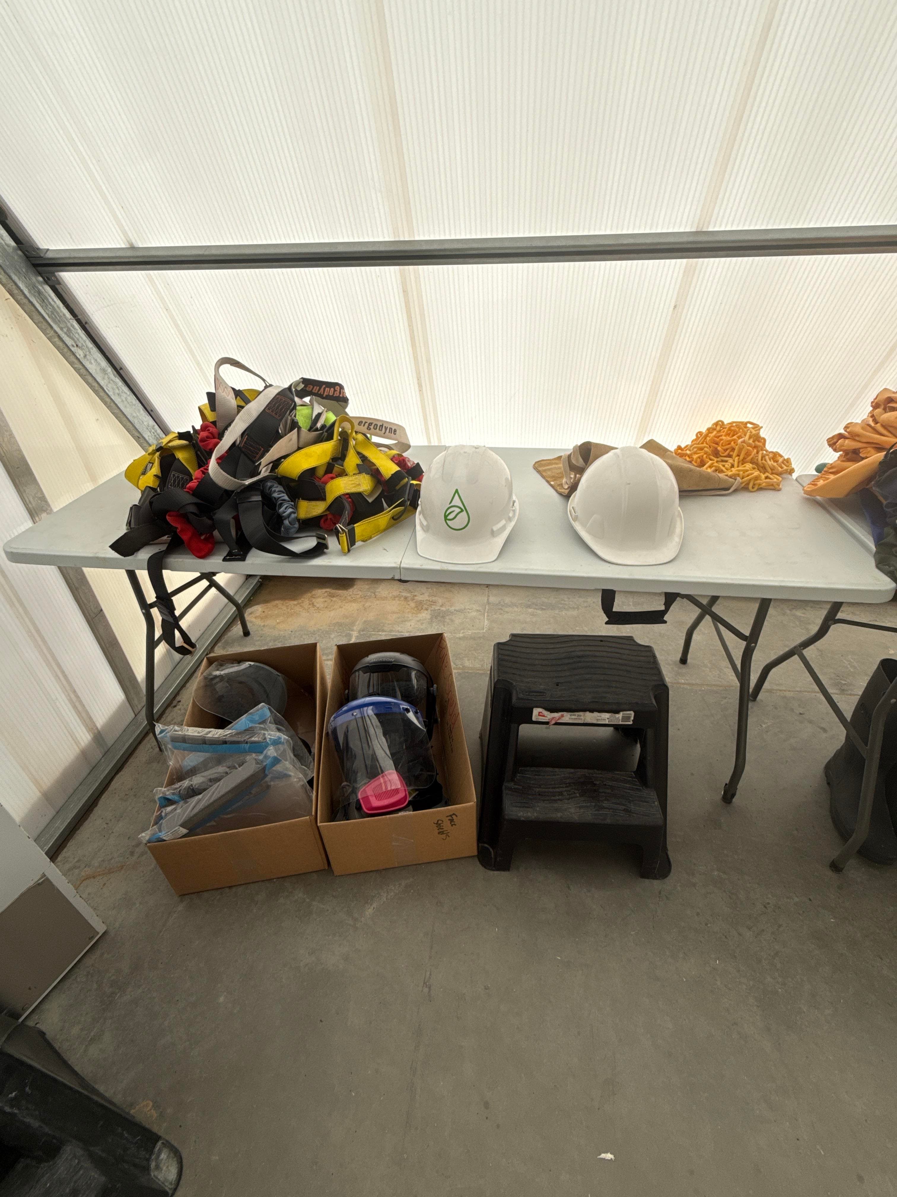 Mixed Safety Gear Lot with Harnesses, Hard Hats, Face Shields and Step Stool